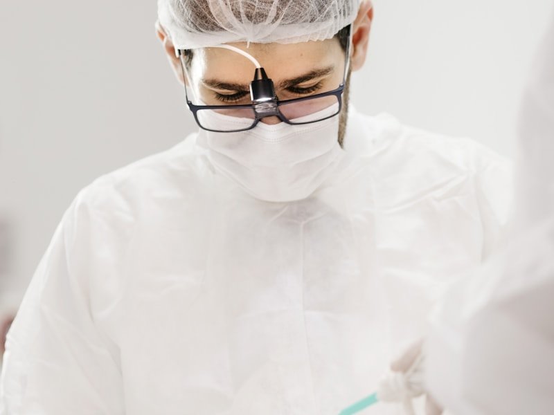 Dental professional preparing a crown restoration