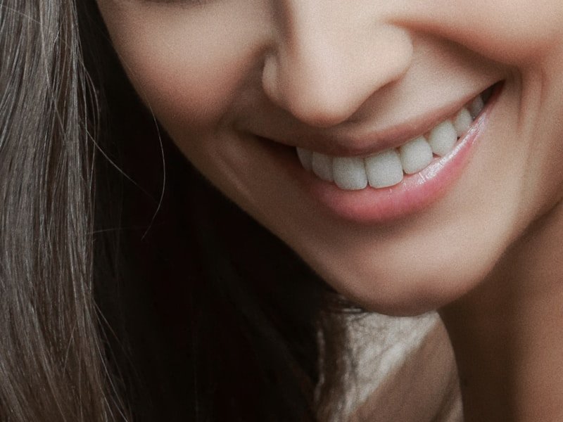 Patient with a restored, confident smile after denture treatment
