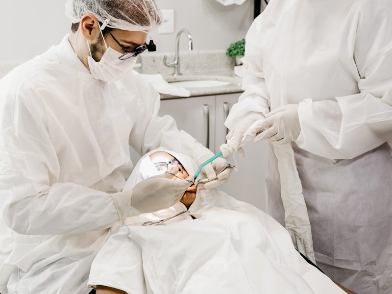 Dental surgeon performing a tooth extraction