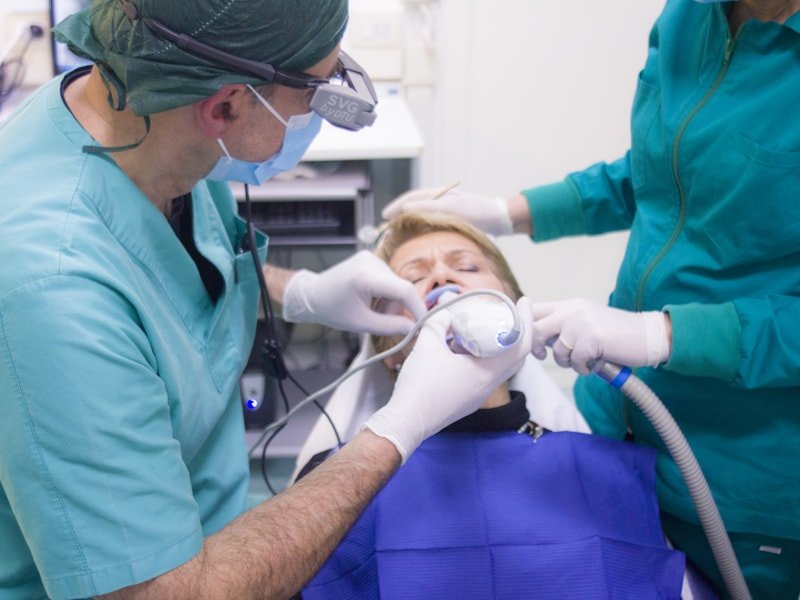 Dental team performing root canal treatment